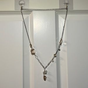 An asymmetrical long necklace with ✨✨